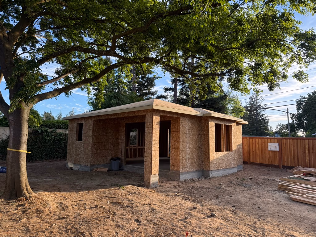 ADU exterior construction in progress — framing and foundation