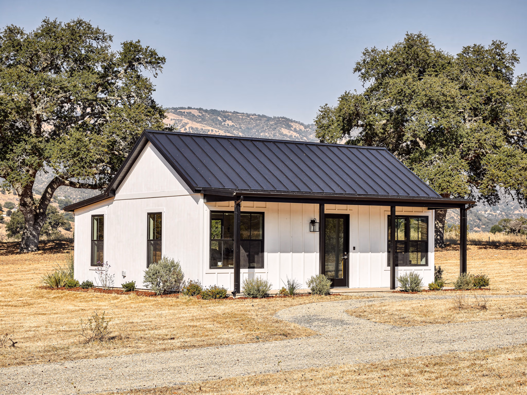 White farmhouse ADU with metal roof in El Dorado Hills