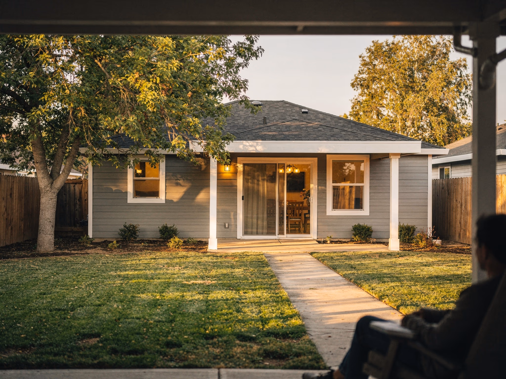Beautiful ADU at golden hour with string lights and patio